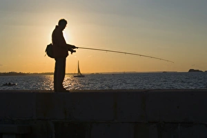 Fisherman on jetty, Saint Malo, Ille et Vilaine, Brittany, France Fisherman on jetty, Saint Malo, Ille et Vilaine, Brittany, France