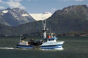 Fishing Boat in Kachemak Bay; Homer; Alaska; USA; with Kenai Mountains in the Background Fishing Boat in Kachemak Bay; Homer; Alaska; USA; with Kenai Mountains in the Background