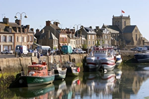 Fishing boats docked in the harbor at the village of Barfleur in the region of Fishing boats docked in the harbor at the village of Barfleur in the region of