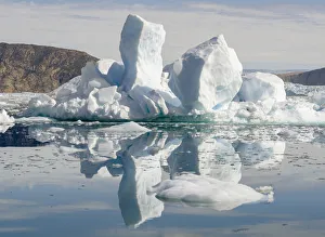 Fjord with icebergs, in the background the Eqip Sermia glacier in Denmarks overseas Fjord with icebergs, in the background the Eqip Sermia glacier in Denmarks overseas