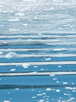 Fjord with icebergs and waves with reflection of Eqip Sermia glacier in Denmark's Fjord with icebergs and waves with reflection of Eqip Sermia glacier in Denmark's