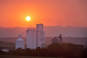 Foggy sunrise over grain elevator in tiny Kathryn, North Dakota, USA Foggy sunrise over grain elevator in tiny Kathryn, North Dakota, USA