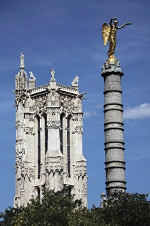France. Paris. The column of Palmier Fountain with Saint-Jacques tower in the background France. Paris. The column of Palmier Fountain with Saint-Jacques tower in the background