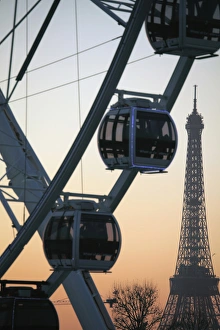 France. Paris. Ferry wheel in Place de la concorde with Eiffel Tower in the background France. Paris. Ferry wheel in Place de la concorde with Eiffel Tower in the background