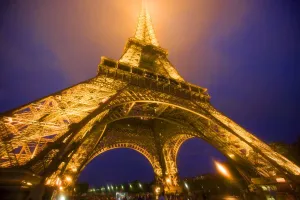France, Paris. Looking up from base of Eiffel Tower lit at night. Credit as: Jim France, Paris. Looking up from base of Eiffel Tower lit at night. Credit as: Jim