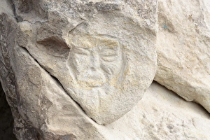 Georgia, Uplistsikhe. A face carved into a stone wall Georgia, Uplistsikhe. A face carved into a stone wall