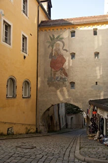 Images Dated 18th September 2009: Germany, Passau. Typical narrow cobblestone street of Passau, historic wall painting