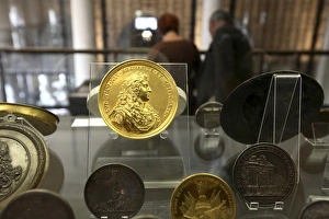 A gold memorial plate with Louis XIVs portrait display in theCabinet des Medailles A gold memorial plate with Louis XIVs portrait display in theCabinet des Medailles