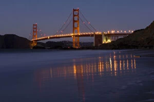 Images Dated 20th January 2008: The Golden Gate Bridget at dusk reflected in the sands of Baker Beach, San Francisco
