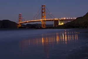 The Golden Gate Bridget at dusk reflected in the sands of Baker Beach, San Francisco The Golden Gate Bridget at dusk reflected in the sands of Baker Beach, San Francisco