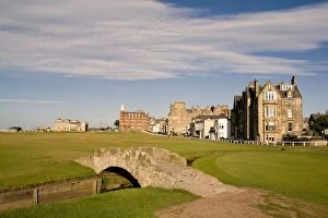 St Andrews Collection: Golfing the special Swilcan Bridge on the 18th hole at the world famous St Andrews