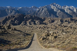 Gravel Road leading towards the Eastern Sierra Mountains in the Alabama Hills of California Gravel Road leading towards the Eastern Sierra Mountains in the Alabama Hills of California
