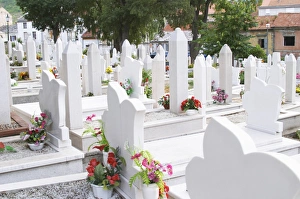 A graveyard with many recent tombs from the war with white tombstones. Along Marsala A graveyard with many recent tombs from the war with white tombstones. Along Marsala