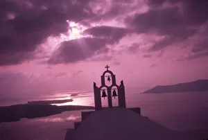 Aegean Sea Gallery: Greece, Aegean Sea, Santorini Island (Thera), Church steeple with evening light rays