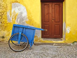 Jim Nilsen Gallery: Greece, Rhodes. House with blue cart in front