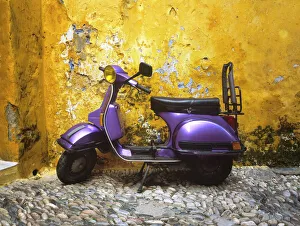 Greece, Rhodes. Vespa motorbike and colorful house exterior Greece, Rhodes. Vespa motorbike and colorful house exterior