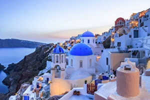 Europe Collection: Greece, Santorini, Oia. Sunset on coastal town