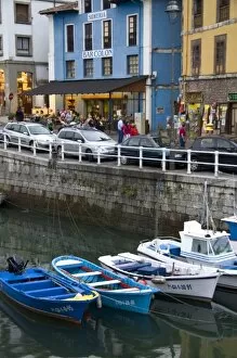 Harbor and storefronts at the fishing port of Llanes, Spain