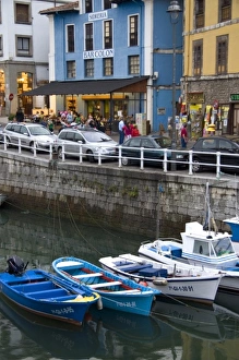 Harbor and storefronts at the fishing port of Llanes, Spain Harbor and storefronts at the fishing port of Llanes, Spain