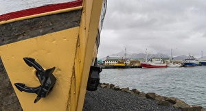 Vatnajokull Gallery: The harbour of the small town Hoefn during winter. Old ship used as a museum in the harbour