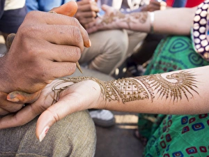 Henna being applied on womans hand in Jaipur, Rajasthan, India Henna being applied on womans hand in Jaipur, Rajasthan, India