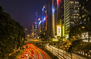 Hong Kong China downtown twilight traffic in Gloucester Road at night with cars streaking Hong Kong China downtown twilight traffic in Gloucester Road at night with cars streaking