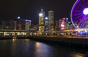 Hong Kong China night skyline with new Ferris Wheel and twilight in city at harbour Hong Kong China night skyline with new Ferris Wheel and twilight in city at harbour