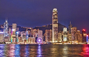 Hong Kong China skyline harbour night with new Ferris Wheel in city skyscrapers Hong Kong China skyline harbour night with new Ferris Wheel in city skyscrapers