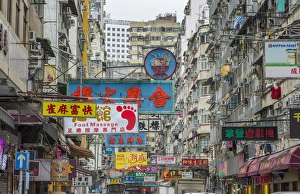 Hong Kong China traffic Kowloon Woosung Street with signs overhanging street Hong Kong China traffic Kowloon Woosung Street with signs overhanging street
