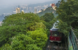 Hong Kong China Victoria Peak Tram going down mountain on smoggy hazy foggy day with Hong Kong China Victoria Peak Tram going down mountain on smoggy hazy foggy day with