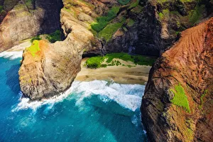 Honopu Arch and Honopu Beach on the Na Pali Coast, Coast Wilderness State Park, Kauai Honopu Arch and Honopu Beach on the Na Pali Coast, Coast Wilderness State Park, Kauai