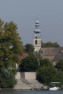 Hungary. Danube River view near Kalocsa. Typical waterfront village with clock tower Hungary. Danube River view near Kalocsa. Typical waterfront village with clock tower