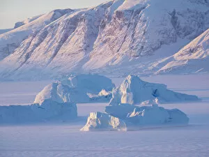 Greenland Collection: Icebergs frozen into the sea ice of the Uummannaq Fjord System during winter