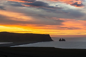 Iceland, Dyrholaey. Sunrise over ocean and land Iceland, Dyrholaey. Sunrise over ocean and land