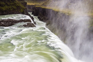 Iceland, Misty Gulfoss. Waterfall flowing into river Iceland, Misty Gulfoss. Waterfall flowing into river