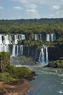 Iguazu Falls on Argentina side and tourist boat on Iguazu River, Brazil and Argentina Iguazu Falls on Argentina side and tourist boat on Iguazu River, Brazil and Argentina