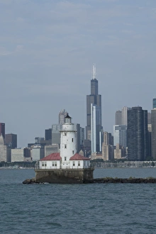 Illinois, Chicago, Lake Michigan. Historic Chicago Harbor Light with Chicago city skyline Illinois, Chicago, Lake Michigan. Historic Chicago Harbor Light with Chicago city skyline