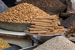 India, Delhi, Old Delhi. Old Delhi street market. Mixed nuts, spices and cinnamon sticks India, Delhi, Old Delhi. Old Delhi street market. Mixed nuts, spices and cinnamon sticks