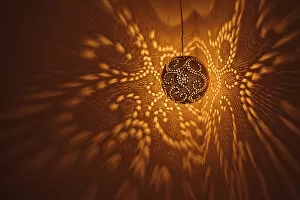 India, Rajasthan, Jaisalmer. Pierced lamp and shadows against wall