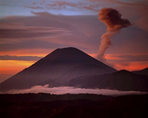 Indonesia. Mt. Semeru emits a plume of smoke moved by strong winds at sunrise. Credit as Indonesia. Mt. Semeru emits a plume of smoke moved by strong winds at sunrise. Credit as