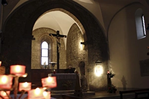 Inside the Romanesque church: tree of candles Inside the Romanesque church: tree of candles