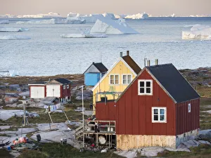 Inuit village Oqaatsut (once called Rodebay) located in Disko Bay. Greenland, Denmark Inuit village Oqaatsut (once called Rodebay) located in Disko Bay. Greenland, Denmark