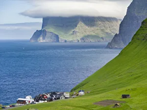 Island Kalsoy, village Trollanes, in background the island Kunoy and Vidoy. Nordoyggjar Island Kalsoy, village Trollanes, in background the island Kunoy and Vidoy. Nordoyggjar