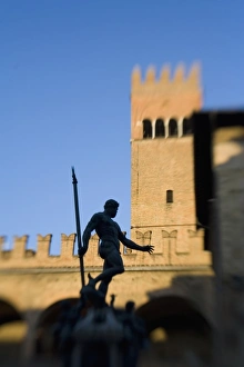 Italy, Bologna, Selective Focus of The Statue of Nettuno with warm evening light Italy, Bologna, Selective Focus of The Statue of Nettuno with warm evening light