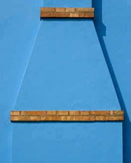 Italy, Burano. Blue stucco exterior of chimney and colored brick Italy, Burano. Blue stucco exterior of chimney and colored brick