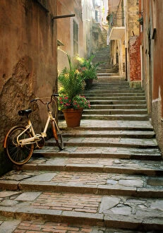 Images Dated 12th September 2018: Italy, Cinque Terre, Monterosso. Bicycle and uphill stairway