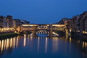 Italy, Florence. Twilight over the Ponte Vecchio Bridge and Arno River Italy, Florence. Twilight over the Ponte Vecchio Bridge and Arno River