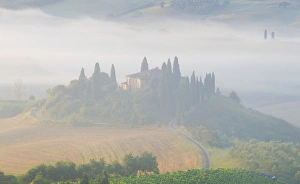 Italy, Tuscany. Belvedere house in morning fog Italy, Tuscany. Belvedere house in morning fog