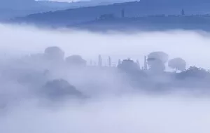 Images Dated 24th July 2014: Italy, Tuscany, Pienza. Morning fog over town