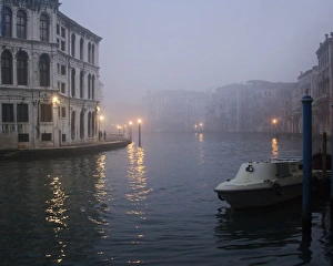 Italy, Venice. Boat moored on Grand Canal in early morning fog Italy, Venice. Boat moored on Grand Canal in early morning fog